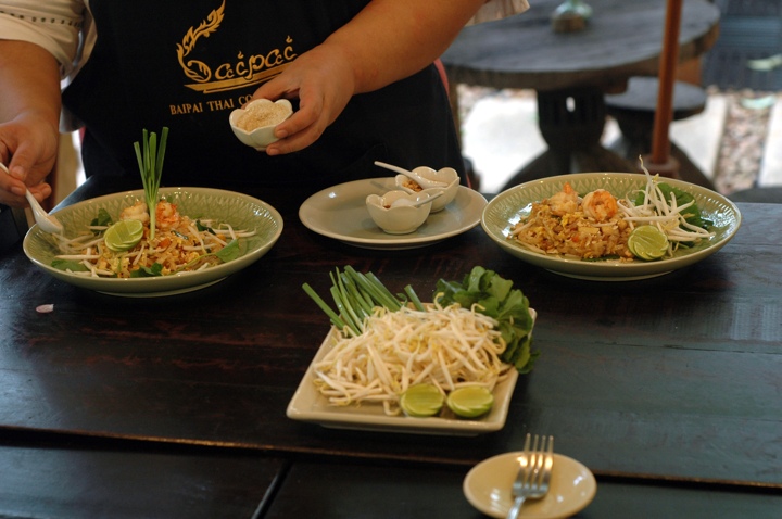 Garnishing the pad thai