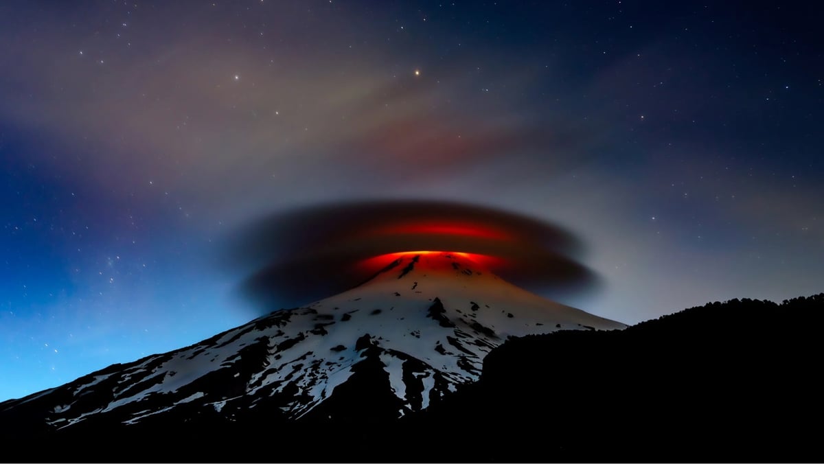 A pair of pleasingly circular clouds is illuminated by lava from the Villarrica volcano in Chile as night falls. The scene was captured by photographer Francisco Negroni, who takes regular trips to the volcano to monitor its activity.