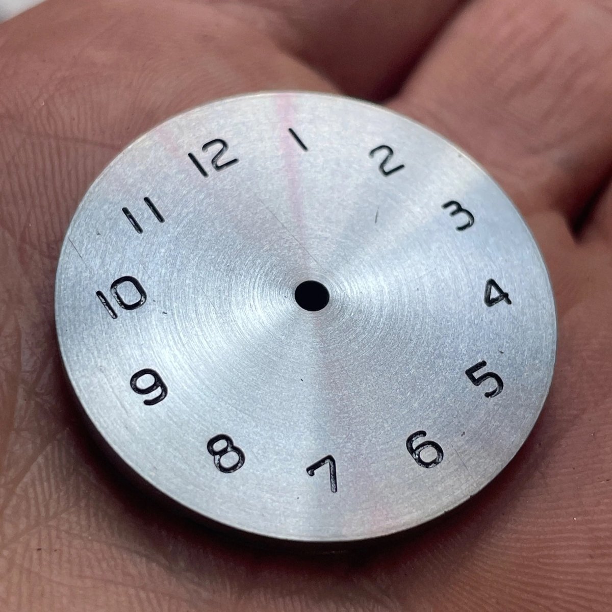 an unfinished watch face