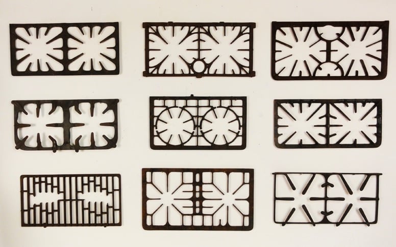 a collection of vintage cook stove grates