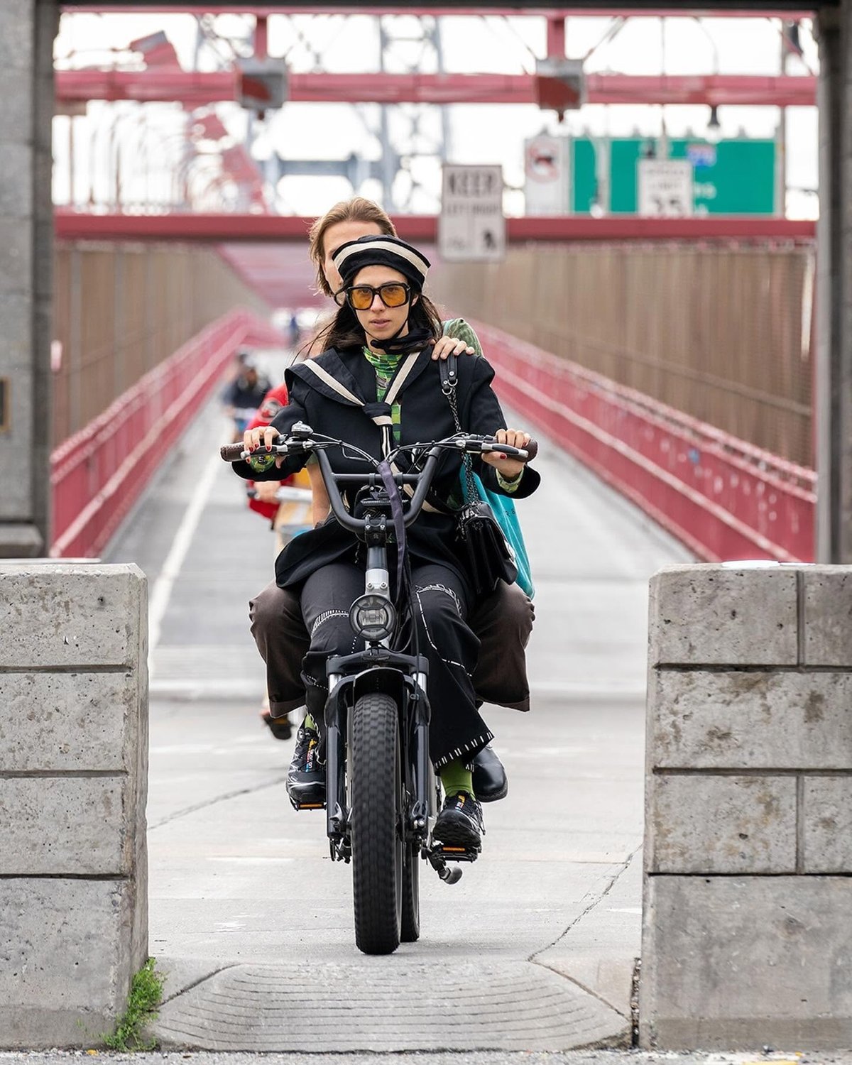 a biker exiting the Williamsburg Bridge bike path