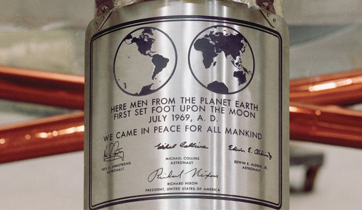 a plaque left by Apollo 11 astronauts on the moon that reads, in part, 'we came in peace for all mankind'