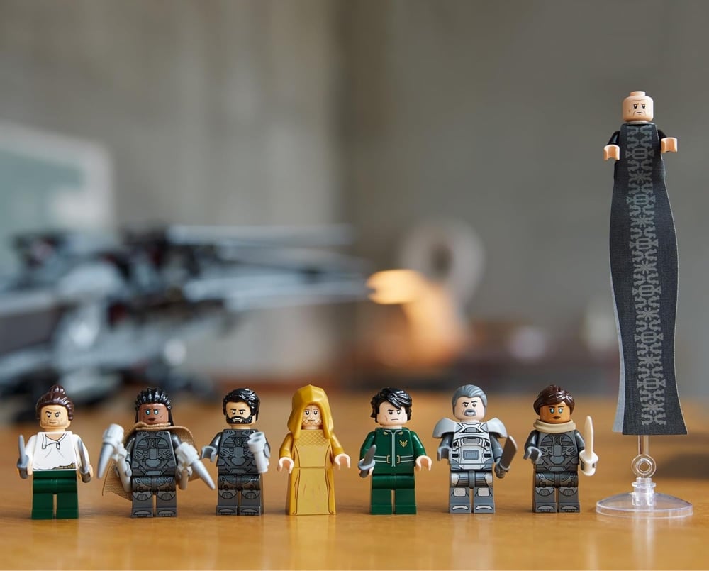 a lineup of the Dune Lego minifigs, inclduing a super-tall Baron Harkonnen