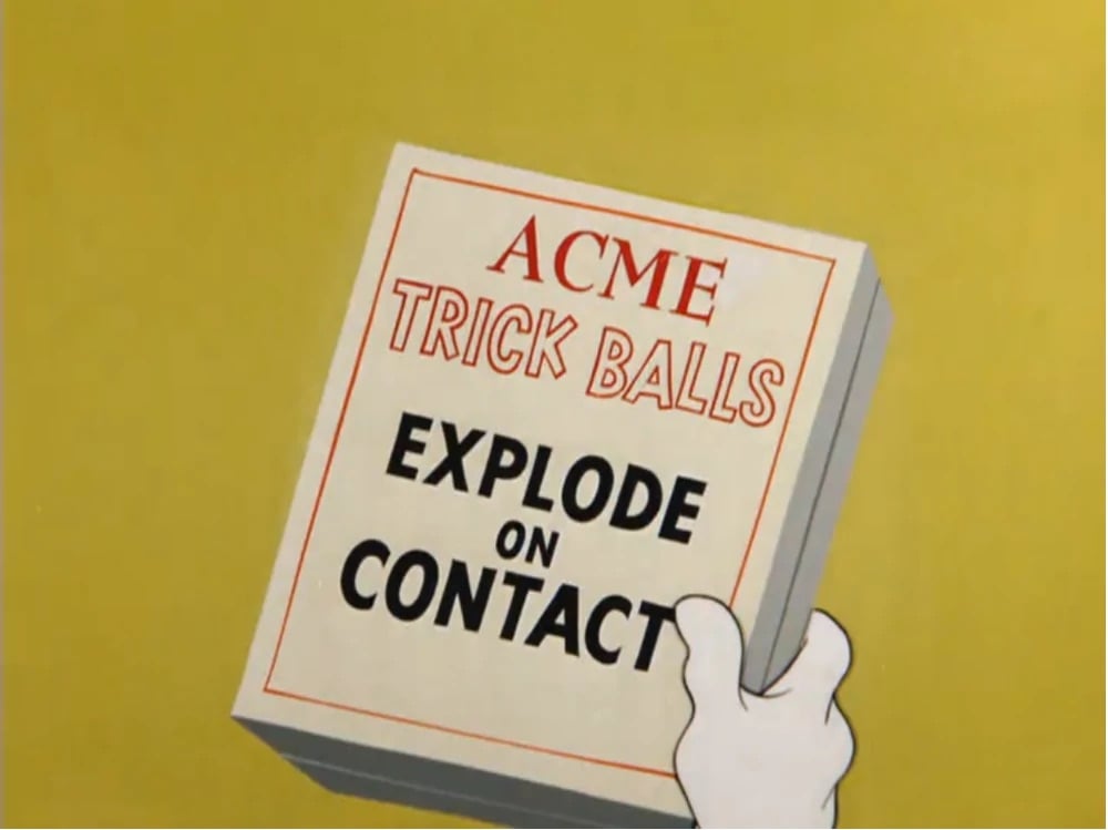 a box from a Looney Tunes cartoon containing ACME trick balls