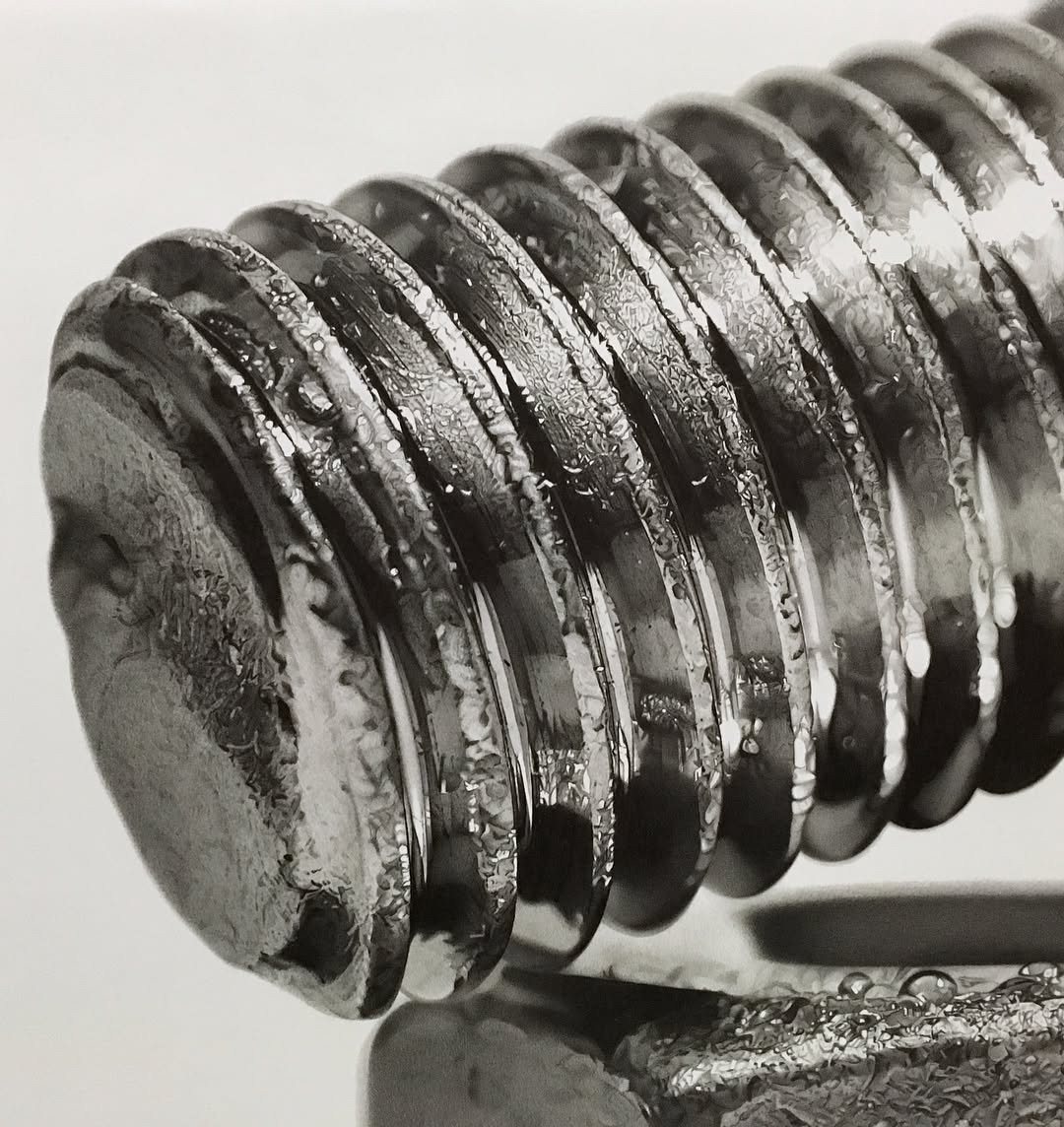 hyperrealistic pencil drawing of the threads on a bolt