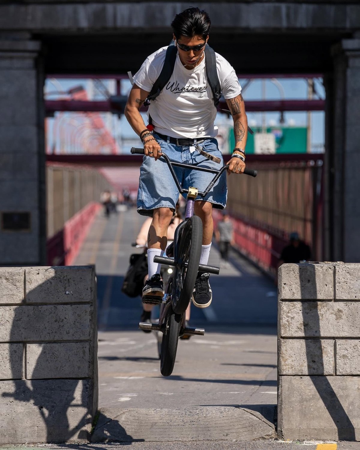 a biker exiting the Williamsburg Bridge bike path