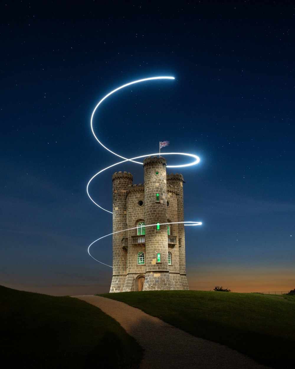 a spiral of light around a castle tower
