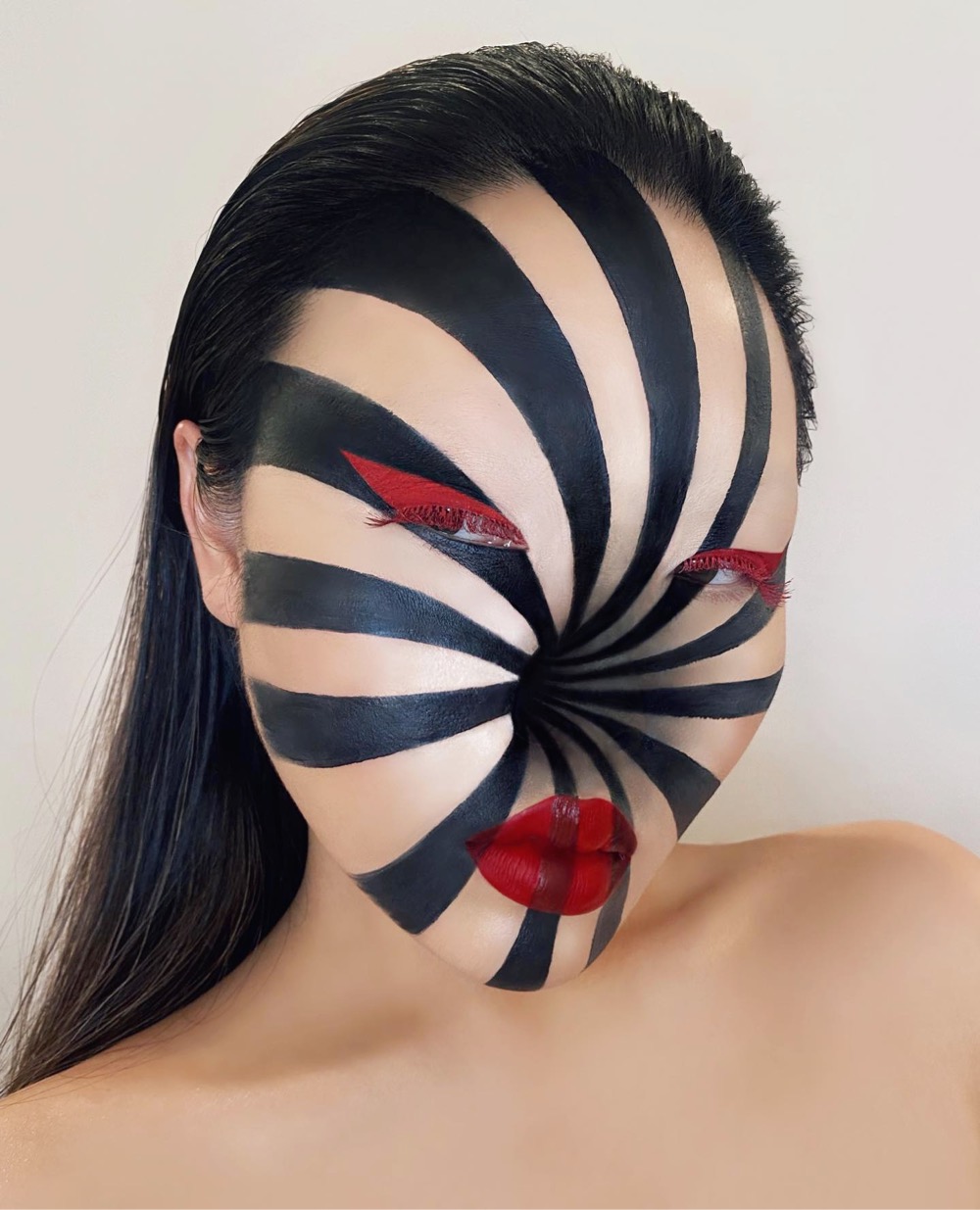 elaborate face makeup that makes it look like there's a hole in the middle of a woman's face