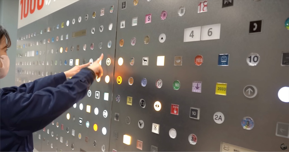 a huge wall of elevator buttons